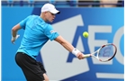 EASTBOURNE, ENGLAND - JUNE 16: Kyle Edmund of Great Britain plays a backhand against Sam Querrey of USA during their Men's Singles first round match on day three of the Aegon International at Devonshire Park on June 16, 2014 in Eastbourne, England.  (Photo by Steve Bardens/Getty Images)